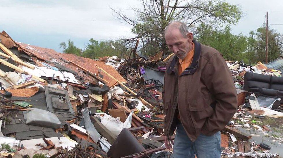After a tornado hit their home, James Moore found his wife trapped under a pile of rubble and a...