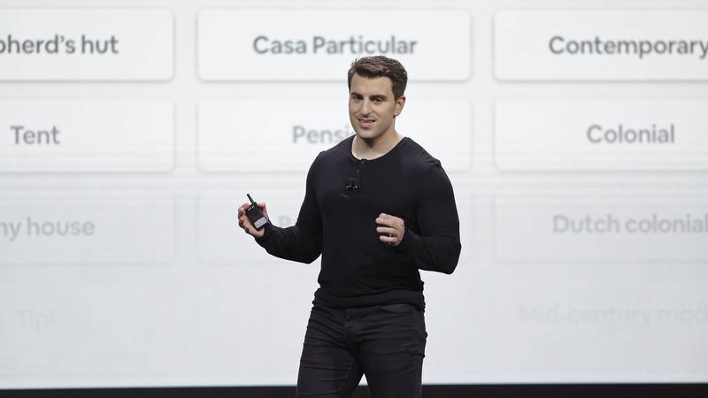FILE - Airbnb co-founder and CEO Brian Chesky speaks during an event, Feb. 22, 2018, in San...