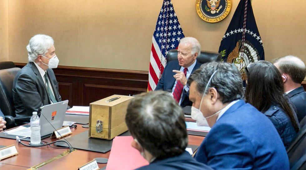 President Joe Biden is shown at the head of the table in the Situation Room getting a briefing...