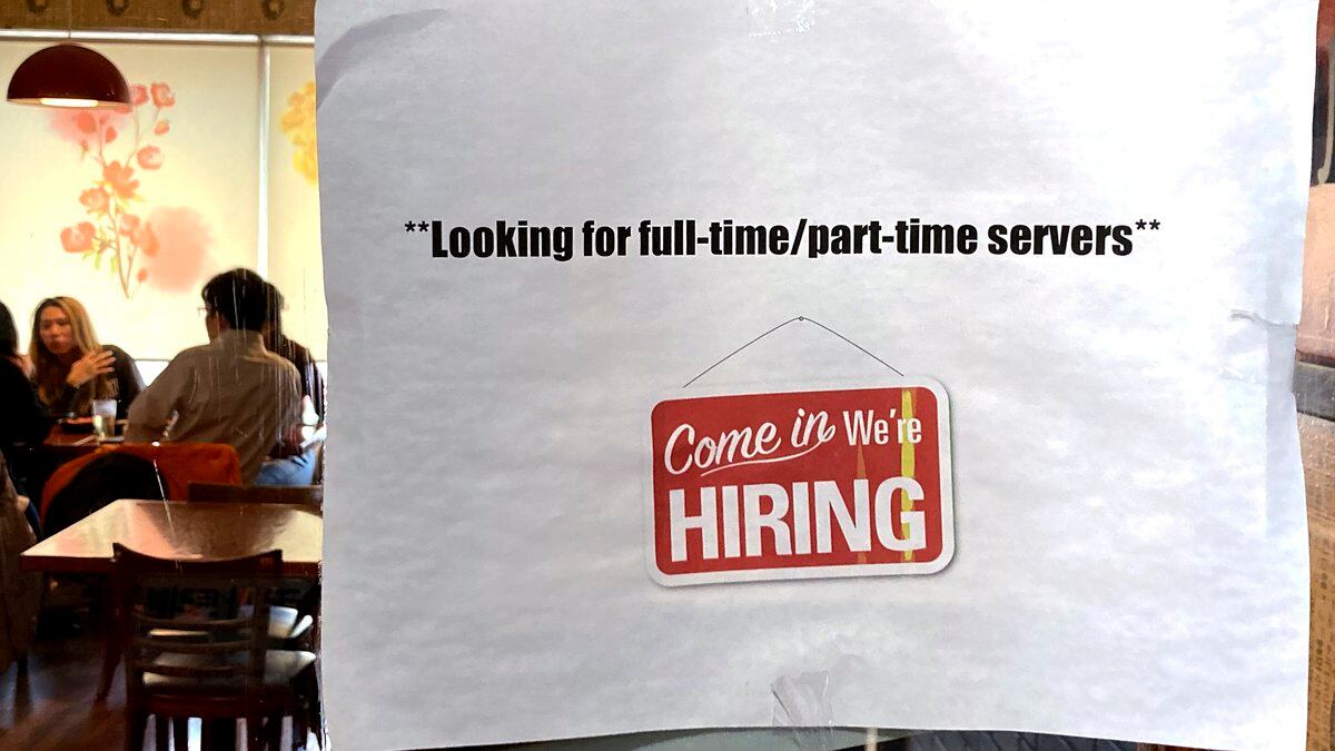 FILE - A hiring sign is displayed at a restaurant in Morton Grove, Ill., Thursday, April 28,...