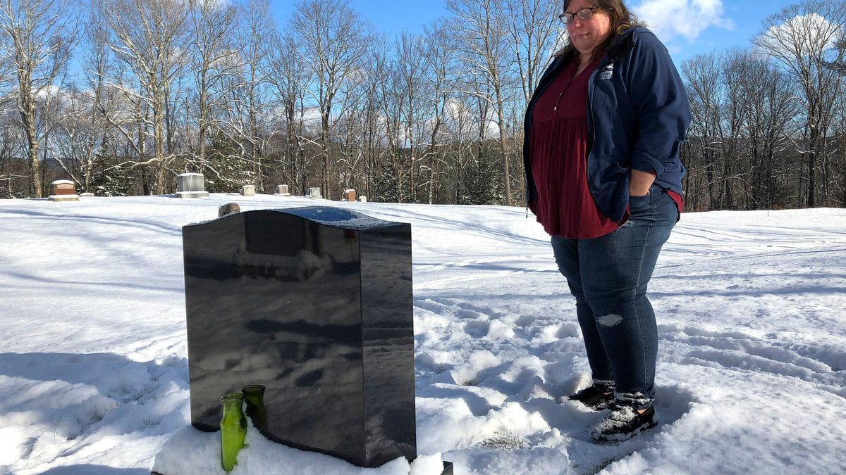 FILE - Deb Walker visits the grave of her daughter, Brooke Goodwin, Thursday, Dec. 9, 2021, in...
