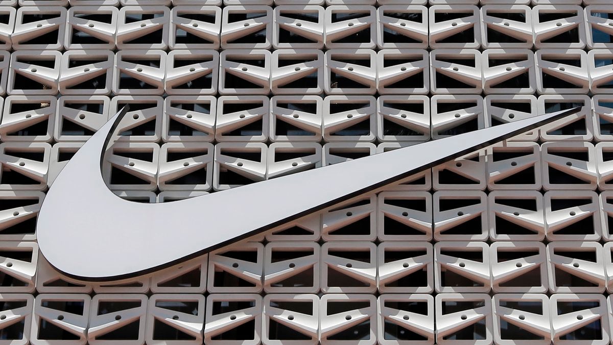 FILE - The Nike logo hangs at a store in Miami Beach, Fla. on Aug. 8, 2017. Nike says it will...