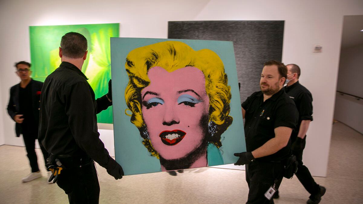 The 1964 painting Shot Sage Blue Marilyn by Andy Warhol is carried in Christie's showroom in...
