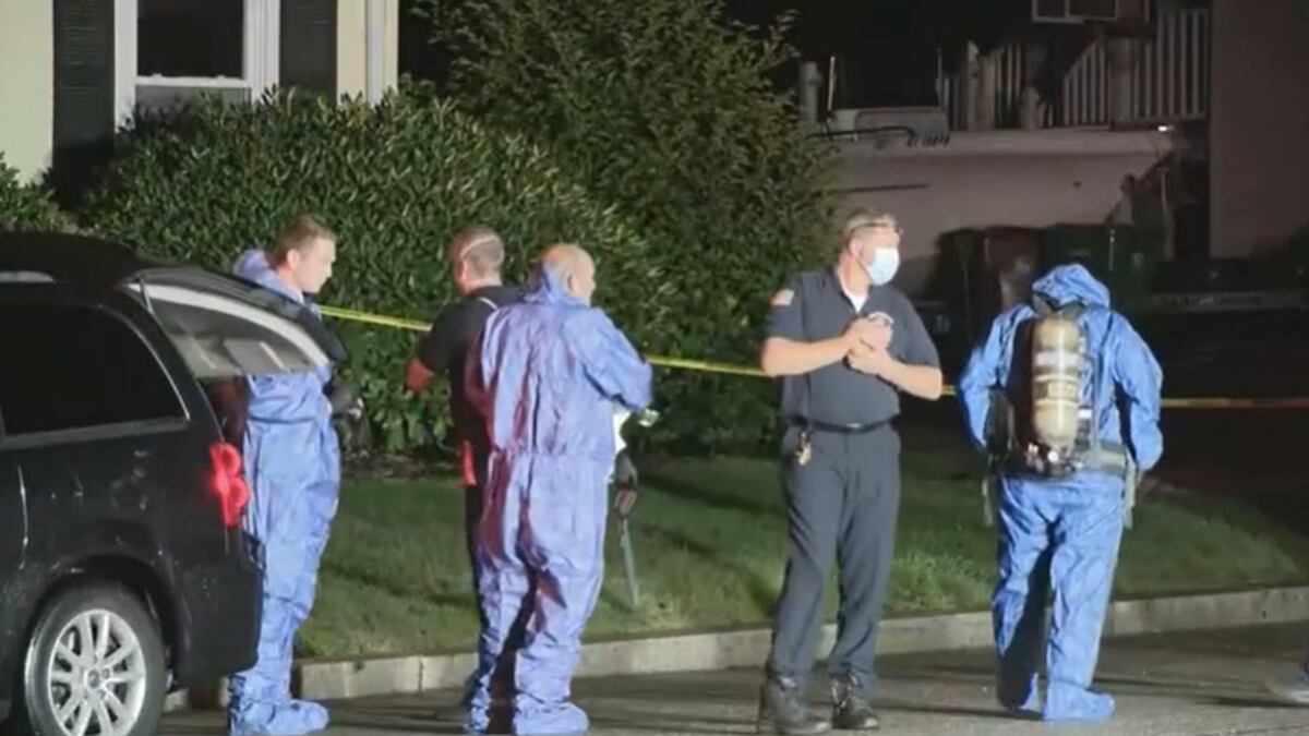 Crews wore hazmat suits with oxygen masks to go in and out of the home to recover the bodies.