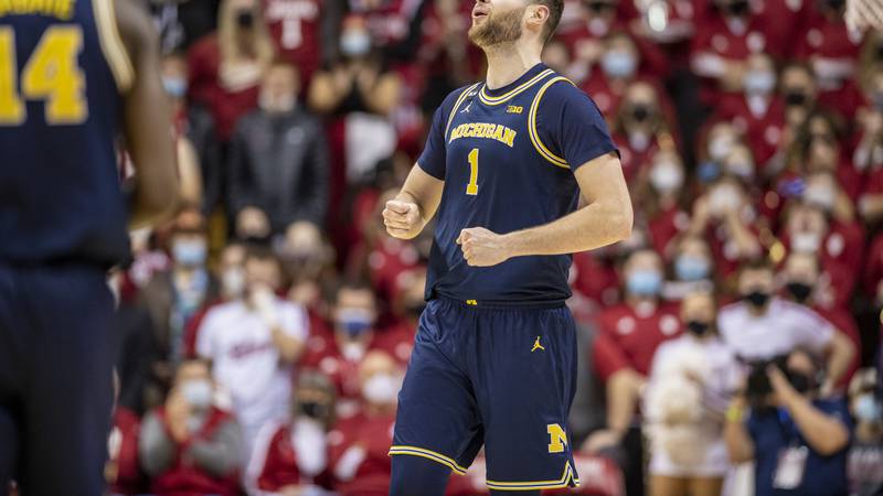 Michigan center Hunter Dickinson (1) reacts after being called for a foul during the second...