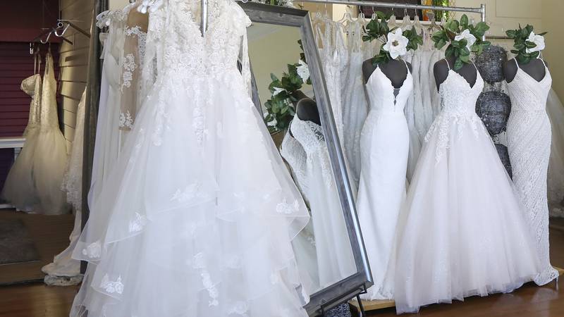 FILE - Wedding dresses are displayed at a bridal shop in East Dundee, Ill., on Feb. 28, 2020....