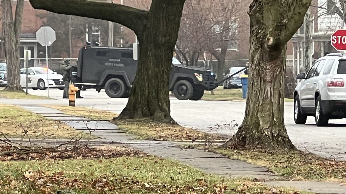 Indiana State Police surround home in North Manchester on Friday, Dec. 31, 2021.