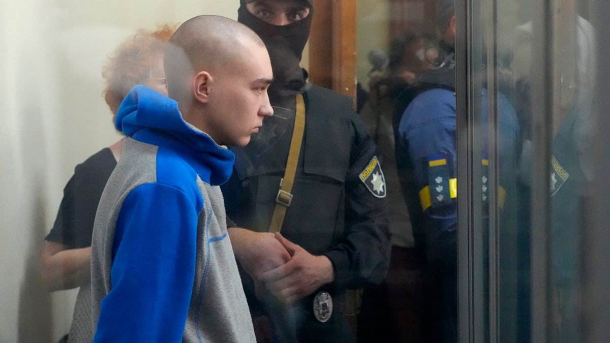 Russian army Sergeant Vadim Shishimarin, 21, is seen behind a glass during a court hearing in...