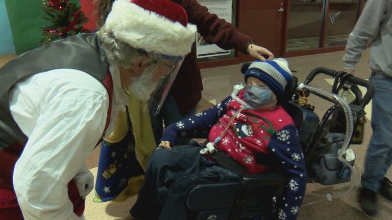 Families reunite at ‘Christmas Party for Kids Surviving Cancer’ at North Side High School