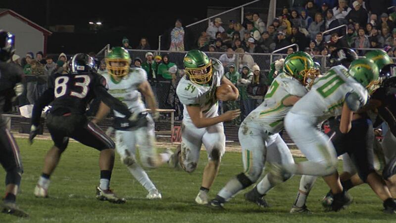 Eastside Blazers running back Dax Holman carries into the end zone for a crucial touchdown.