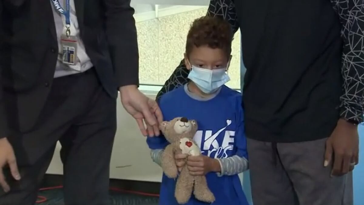 The stuffed animal became stuck at the airport after 5-year-old Ezekiel tossed it into the...