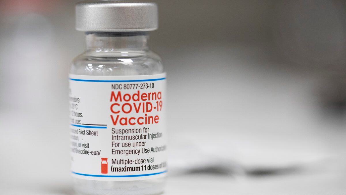 A vial of the Moderna COVID-19 vaccine is displayed on a counter at a pharmacy in Portland,...