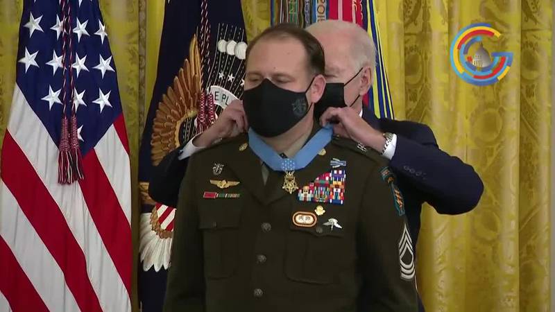 President Biden presents Army Master Sergeant Earl Plumlee with the Medal of Honor during a...