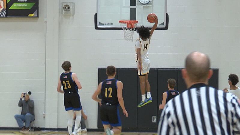 Snider guard Aidan Lambert soars for the slam in the Panthers victory over East Noble.