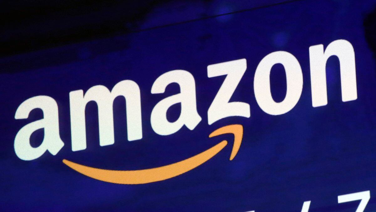 FILE - The Amazon logo is displayed on a screen at the Nasdaq MarketSite, July 27, 2018. The...