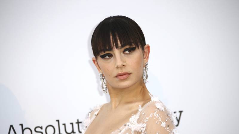 FILE - Charli XCX poses for photographers upon arrival at the amfAR, Cinema Against AIDS,...