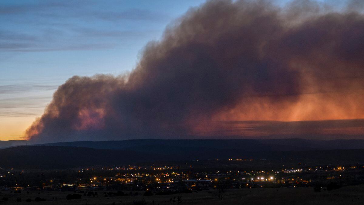 Smoke from the Calf Canyon/Hermits Peak Fire drifts over Las Vegas, N.M., on Saturday, May 7,...