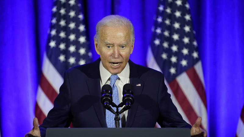 President Joe Biden speaks at a Democratic National Committee holiday party, Tuesday, Dec. 14,...