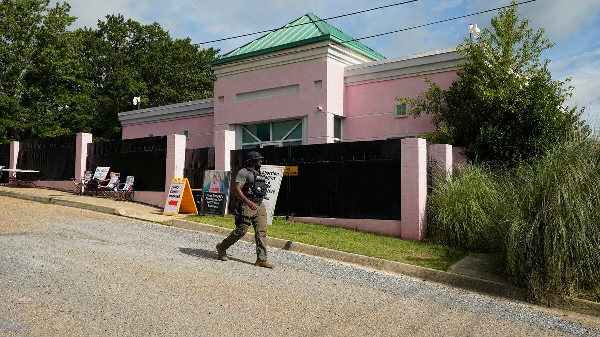 A security officer walks past the front of the Jackson Women's Health Organization clinic in...