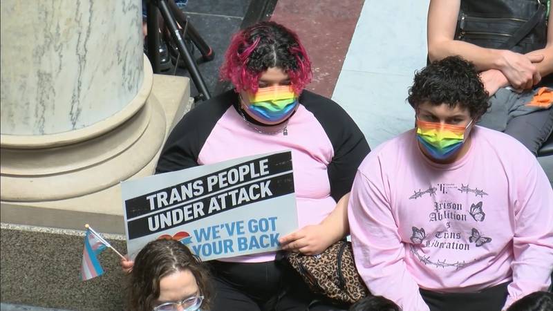 People gathered at the Statehouse on Tuesday to protest the overturning of the transgender...