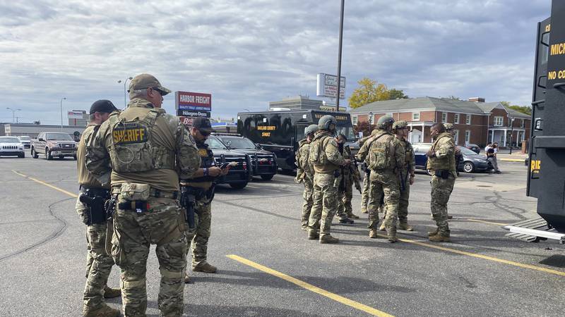 Law enforcement personnel arrive to the scene of an active shooter in Dearborn, Mich.,...