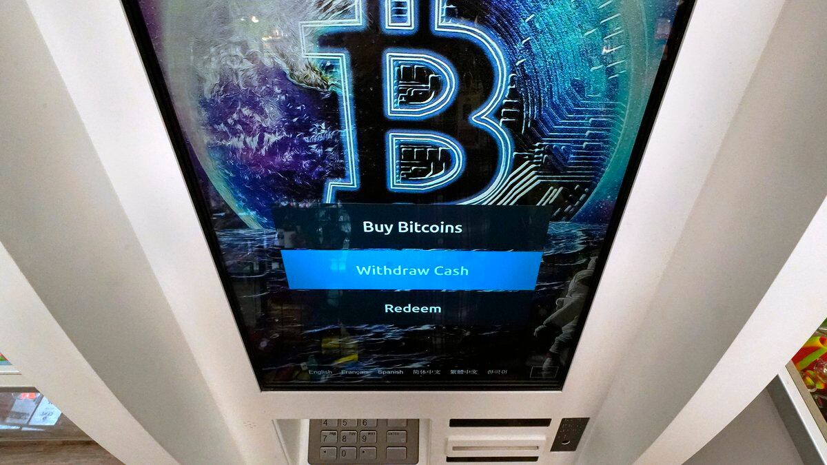 The Bitcoin logo appears on the display screen of a cryptocurrency ATM in Salem, N.H., Feb. 9,...