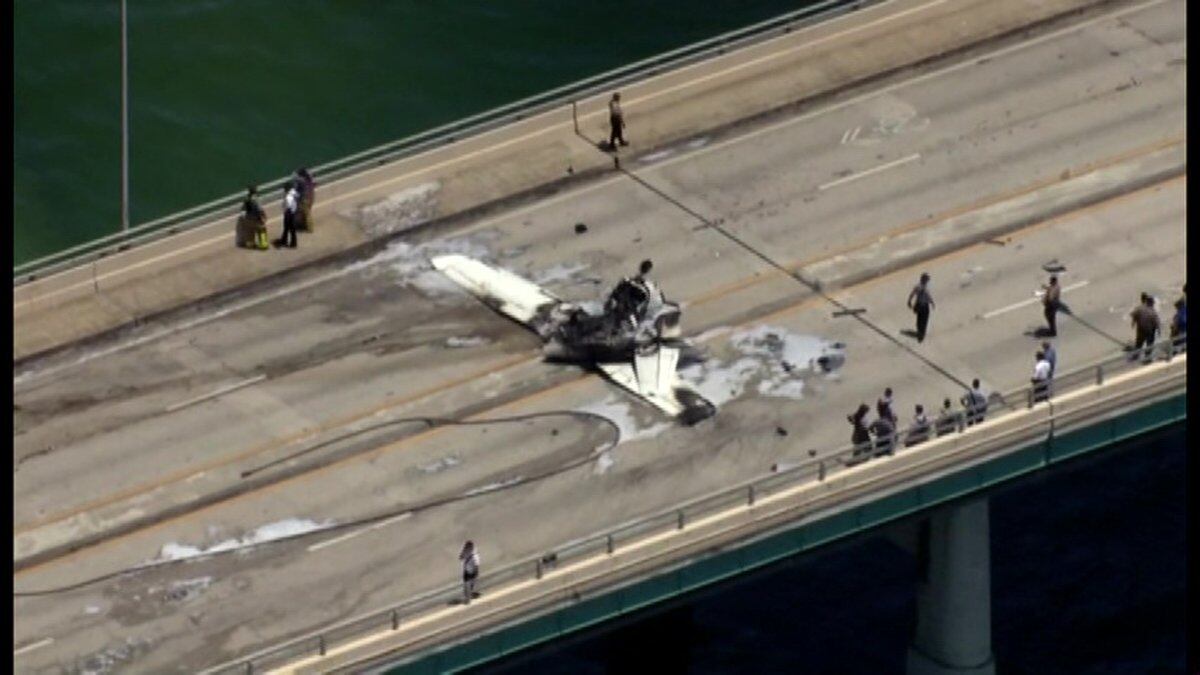 A small plane has crashed on a bridge near Miami, striking an SUV and bursting into flames.