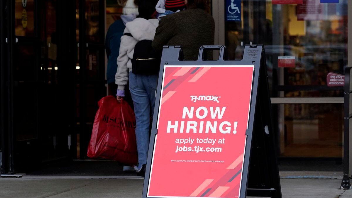 Hiring sign is displayed outside of a retail store in Vernon Hills, Ill., Saturday, Nov. 13,...