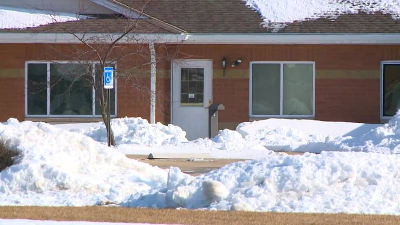 A woman has died after being found outside an Iowa assisted living facility in freezing...