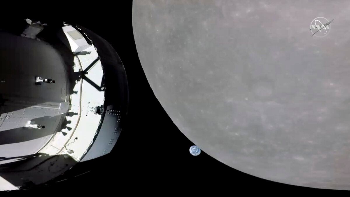 This screengrab from NASA TV shows NASA's Orion capsule, left, nearing the moon, right, Monday,...