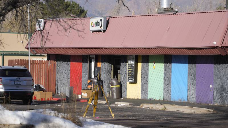 The door to Club Q is open as investigators continue to collect evidence after a mass shooting...