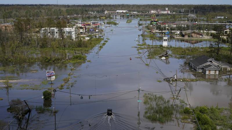 FILE - Homes, businesses and roads are flooded in the aftermath of Hurricane Ida in LaPlace,...