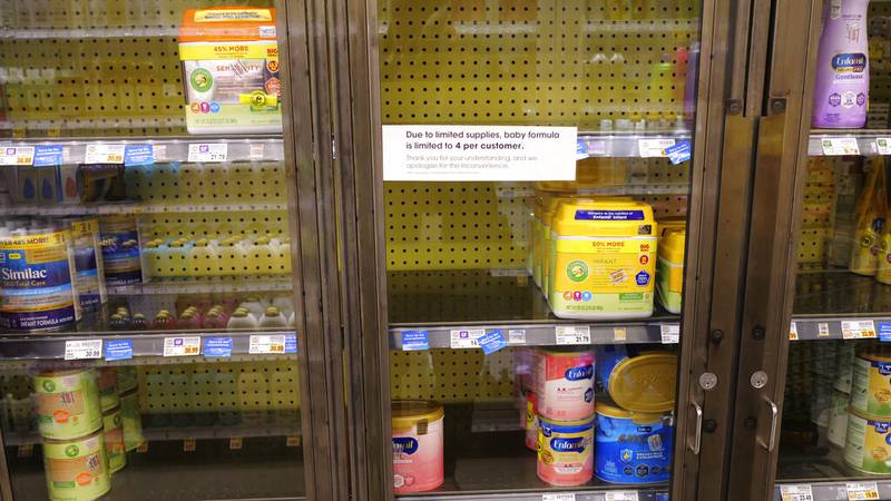 A due to limited supplies sign is shown on the baby formula shelf at a grocery store Tuesday,...