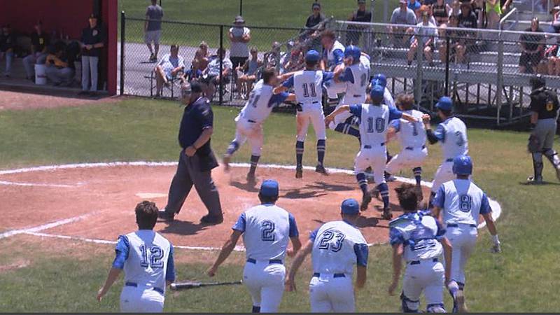 Carroll's Daniel Kirk and teammates celebrate after wild walk-off victory to claim sectional...
