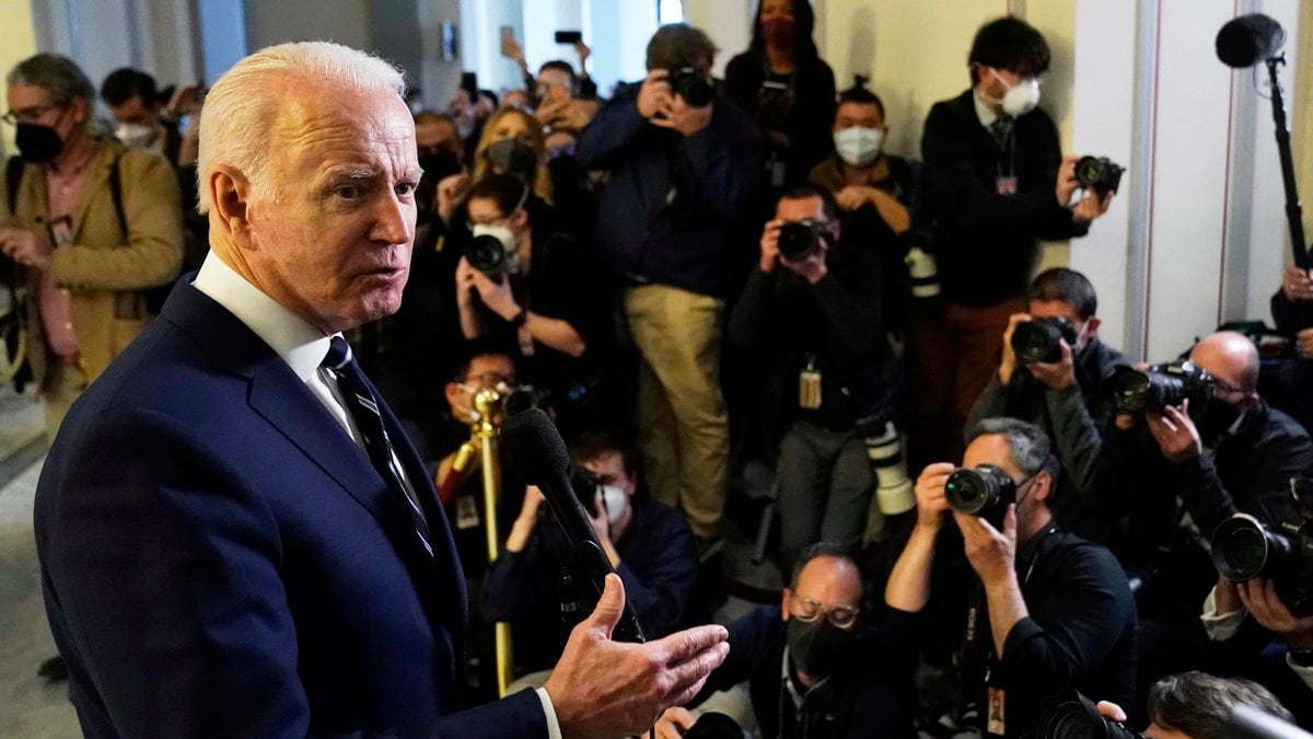 President Joe Biden speaks to the media after meeting privately with Senate Democrats,...