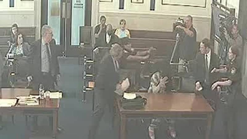 Surveillance footage captured tense moments in court where a boy's biological father attacked...