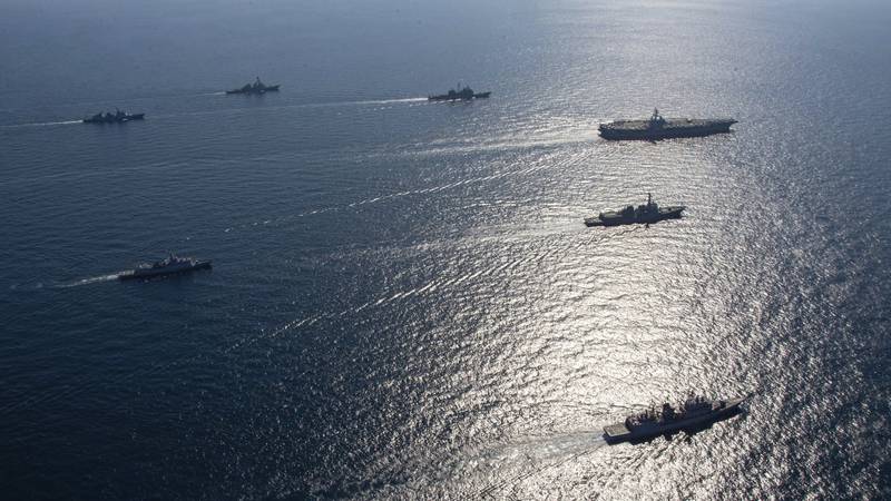FILE - U.S. aircraft carrier USS Ronald Reagan, top right, participates with other U.S. and...