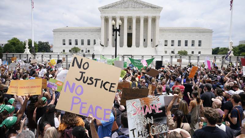 Protesters gather outside the Supreme Court in Washington, Friday, June 24, 2022. The Supreme...