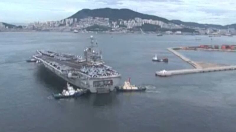 More than 200 sailors move off an aircraft carrier after multiple suicides.