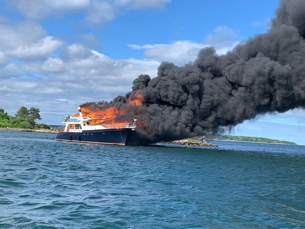 No injuries were reported after a burning yacht called “Elusive” sank in the Piscataqua River.