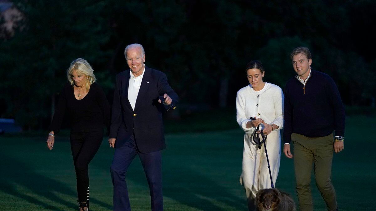 FILE - President Joe Biden and fist lady Jill Biden, left, walk with their granddaughter Naomi...