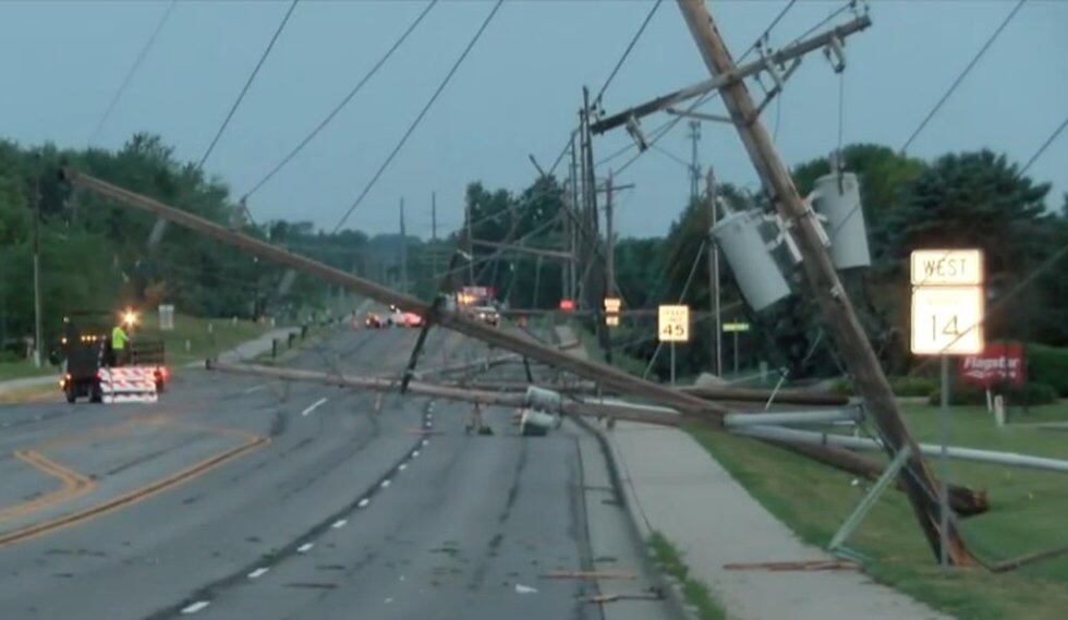Power lines block several lanes of Illinois Road at Scott Road after being downed by the June...