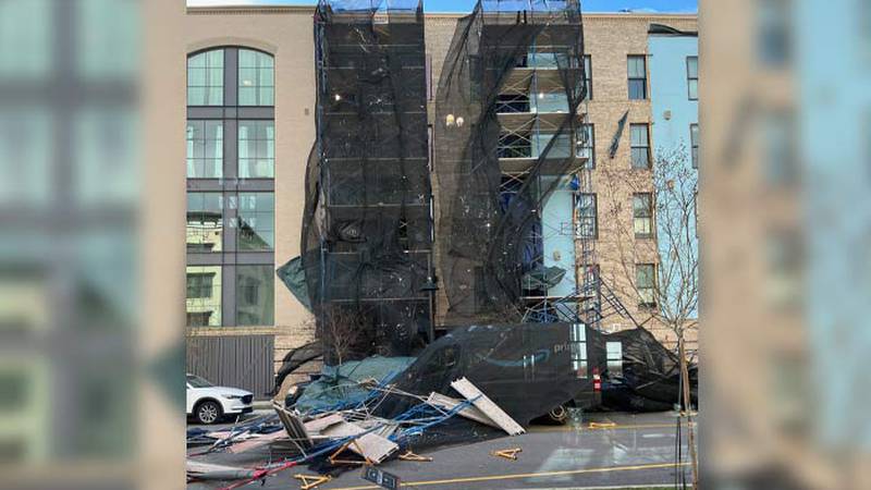 A scaffolding collapsed Monday during high winds outside a Sotille Street apartment building in...