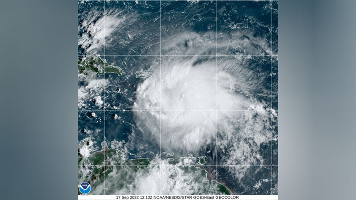 Tropical Storm Fiona approaches the Caribbean in the still image from the National Oceanic and...