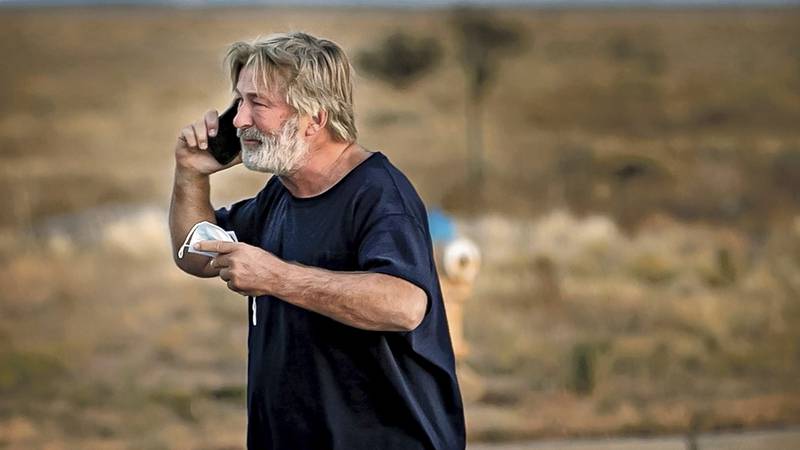 Alec Baldwin speaks on the phone in the parking lot outside the Santa Fe County Sheriff's...