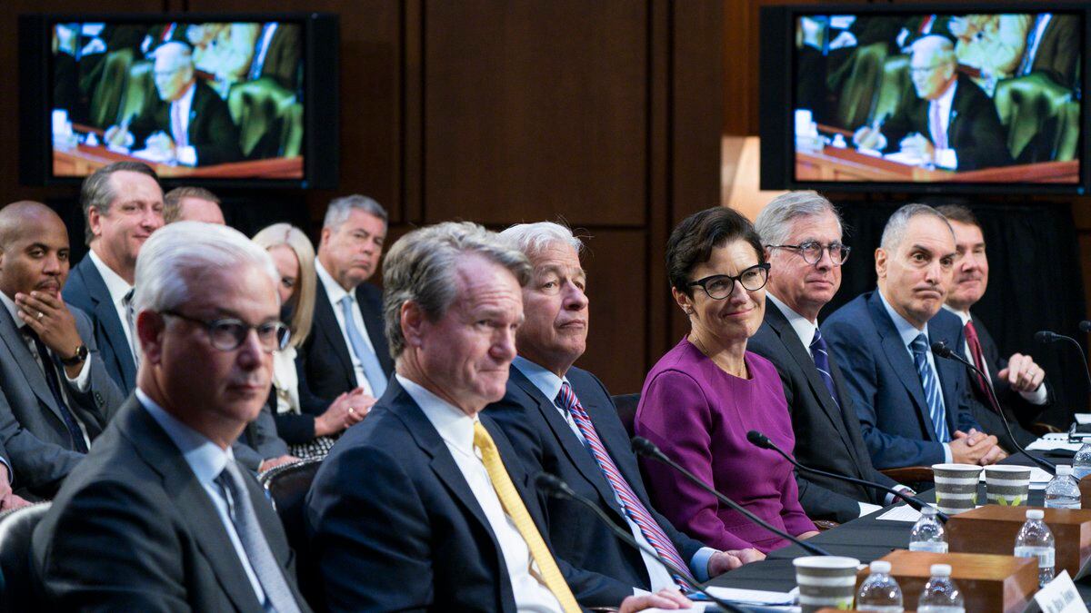 From left, Wells Fargo & Company CEO and President Charles Scharf, Bank of America Chairman and...