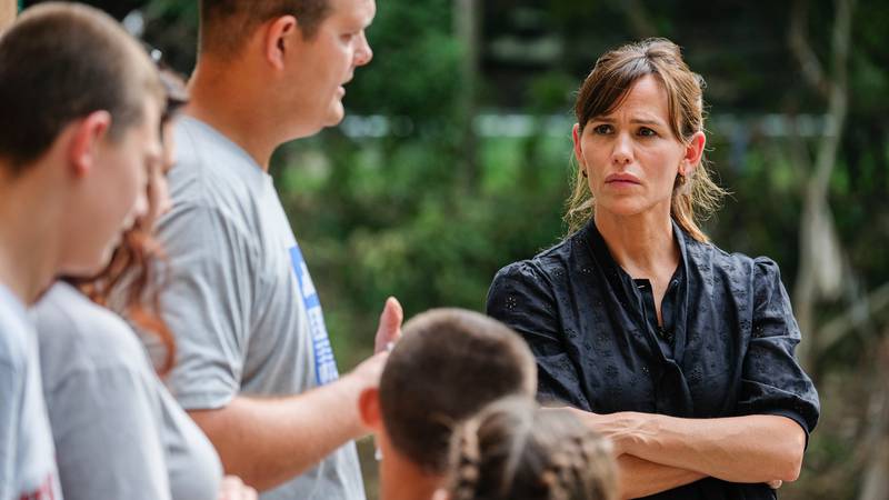 Actor and Save the Children Trustee Jennifer Garner, left, speaks to a family impacted by the...