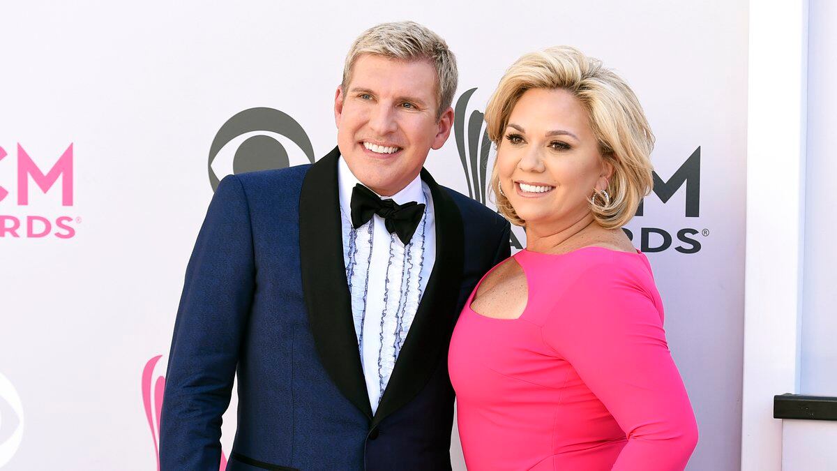Todd Chrisley, left, and his wife, Julie Chrisley, pose for photos at the 52nd annual Academy...