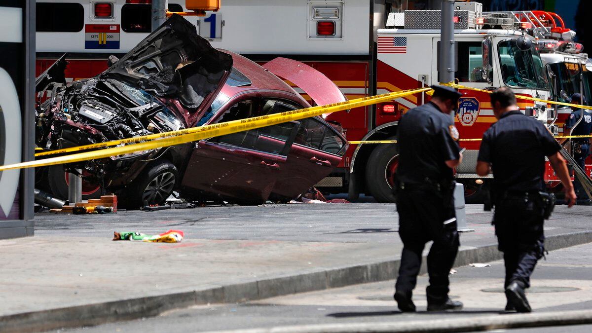 FILE- A smashed car sits on the corner of Broadway and 45th Street in New York's Times Square,...