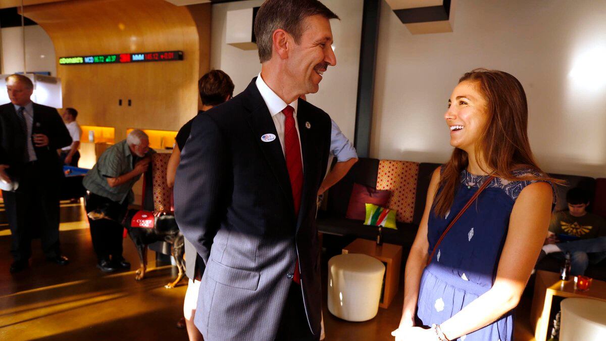 Tulsa District Attorney candidate Steve Kunzweiler, left, chats with his daughter Jennifer...
